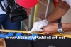 Attaching Handles on Stand Up Paddle Board at Wet Feet Hawaii