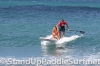 zane-and-shelby-schwietzer-tandem-sup-surfing-04